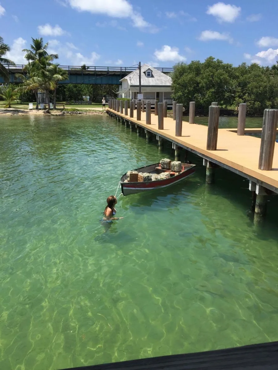 A student placing blocks with chemical cues and nutrients to attract coral larvae as part of a restoration project at Pigeon Key, Florida